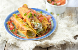 #7layerdip taquitos are stuffed with beans, sour cream, guacamole, and cheese and then fried to perfection and served with fresh pico. #marchmadness ohsweetbasil.com-7