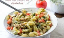 Quick and easy pasta that comes together in under 30 min with a lemon basil dressing and fresh tomatoes ohsweetbasil.com